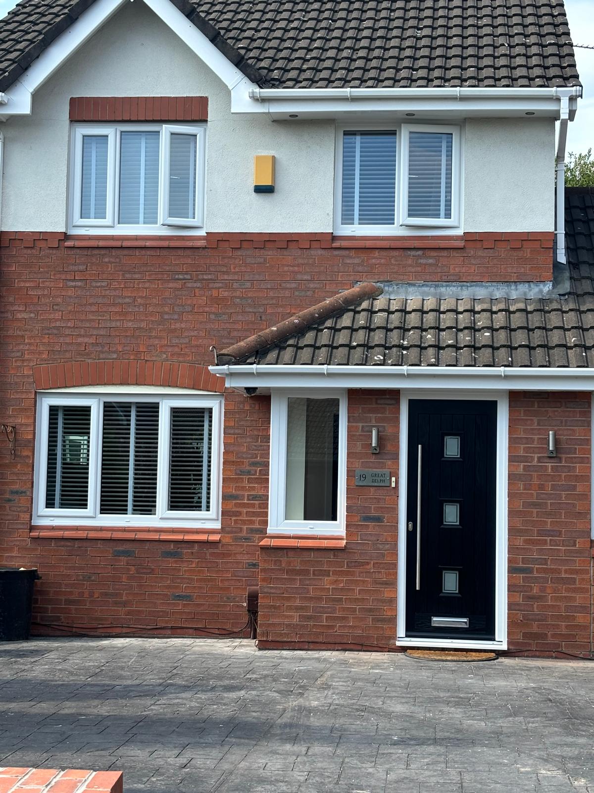 Black composite door with glass panels